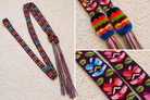 A collage showing a colorful woven Guatemalan-style wristlet or strap laid flat on a cream textured surface, with two close-up inset views highlighting the striped knotted ends and the detailed floral geometric pattern.
